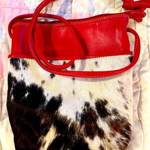 ili New York Red Leather/Calf
Hair Midi Sac Crossbody.
$15 Limited Collection.